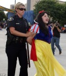 Snow White is brought in by investigators.